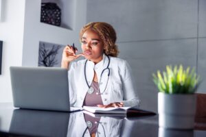 female doctor looking at computer