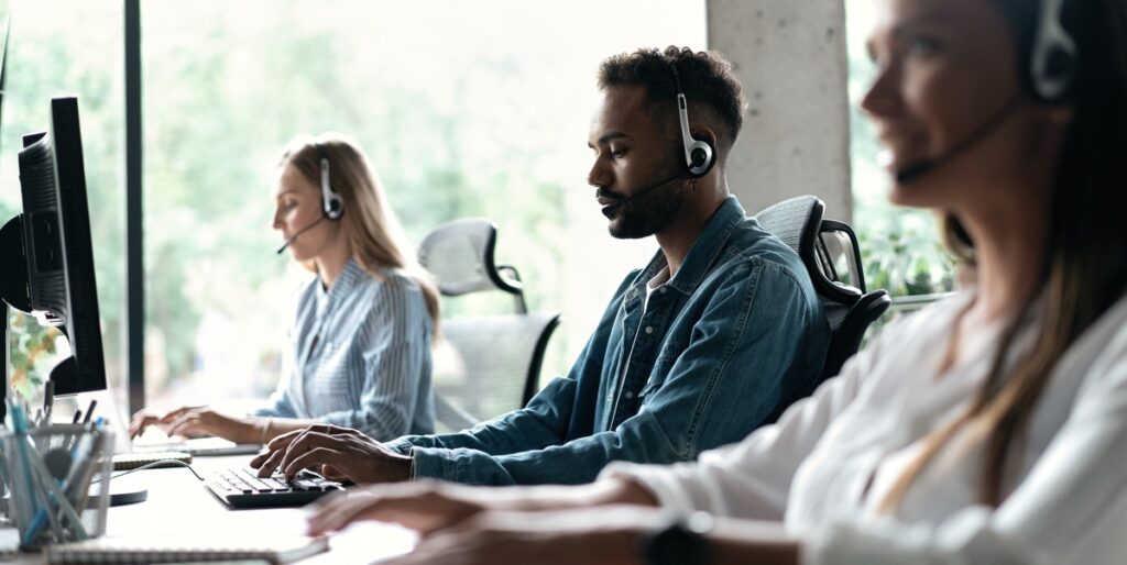 Three phone operators doing outsource sales.