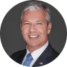 Portrait of a smiling man in a suit.