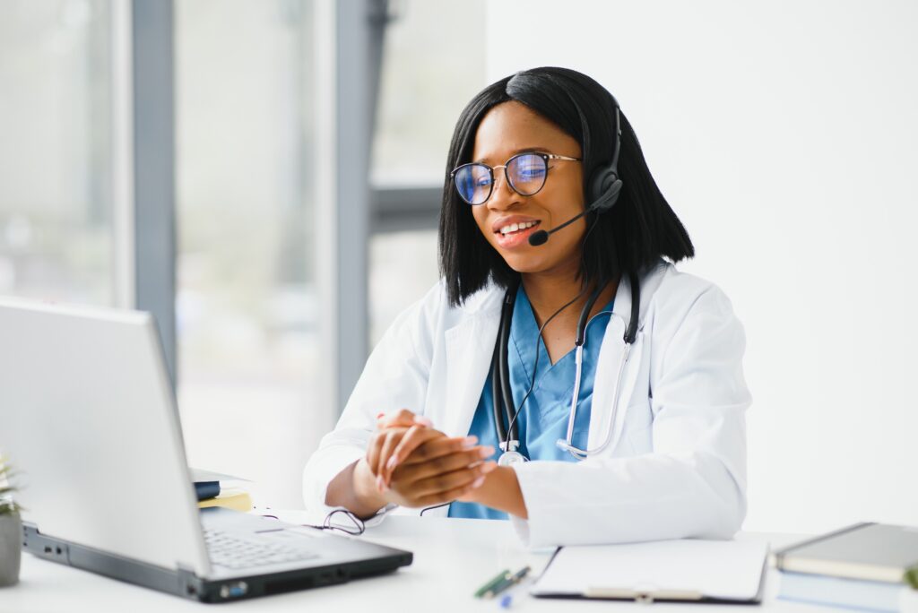 Doctor consulting patient online with headset