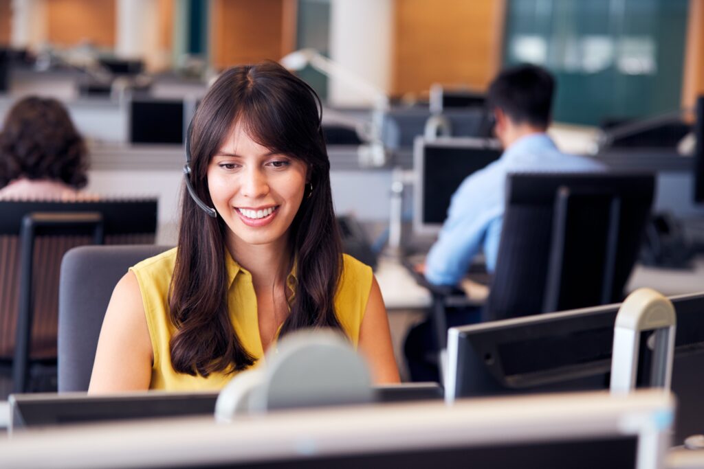 Female customer service agent smiling with headset