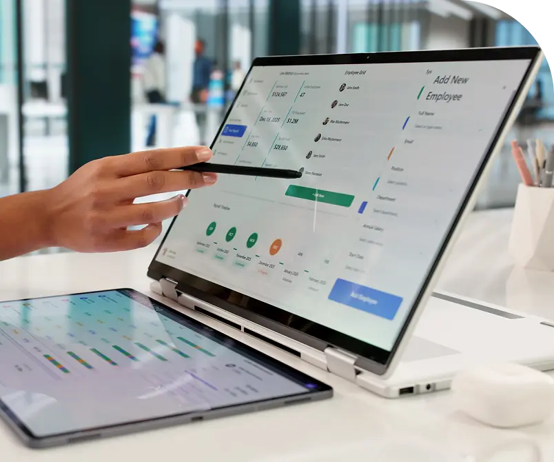 Hand pointing at virtual staff software on laptop