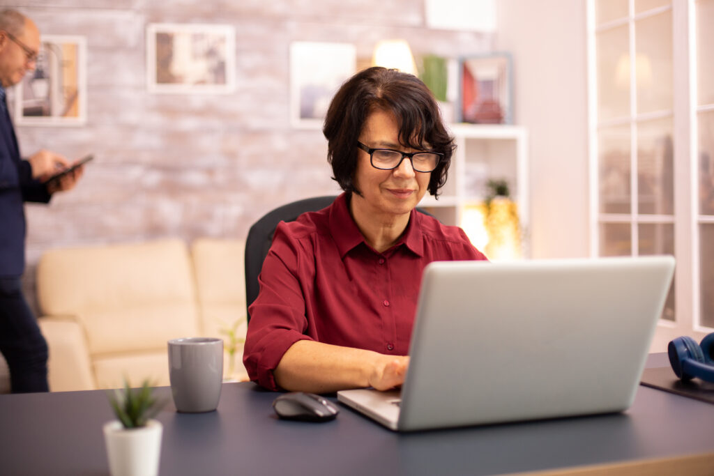 Woman working on laptop in home office