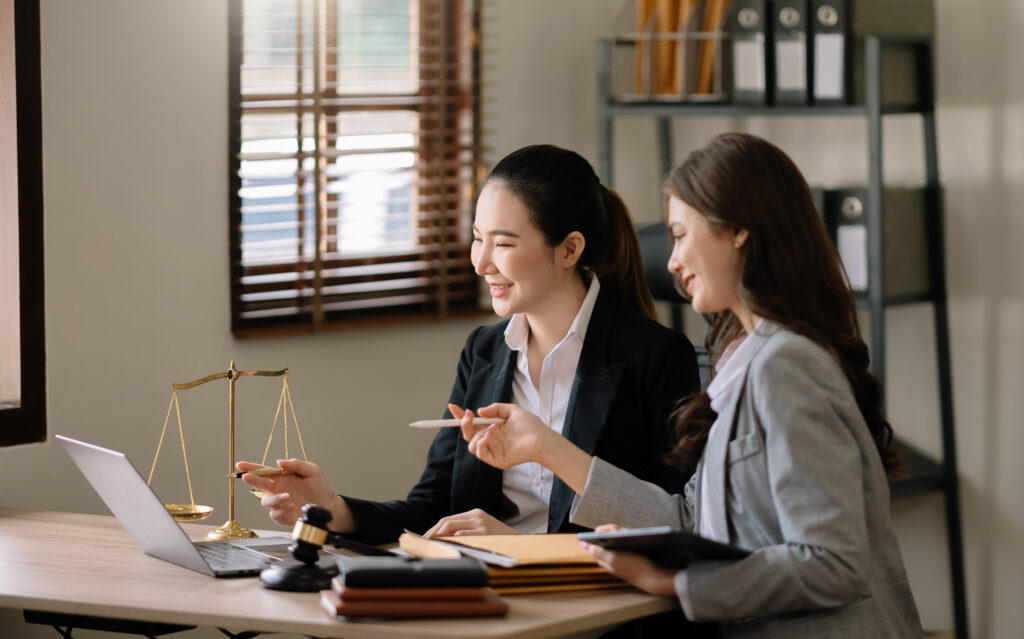 Female lawyers reviewing legal documents together